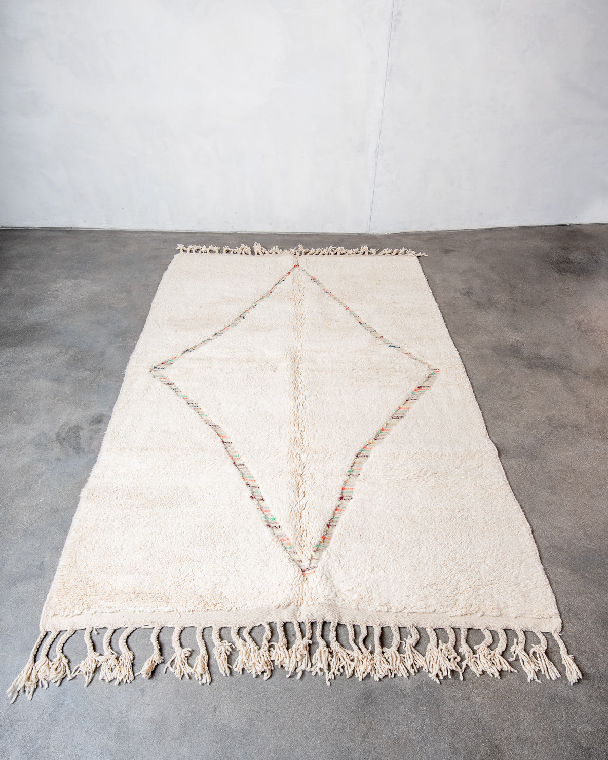 Modern, designer, handcrafted Berber rug from Morocco. Beniourain carpet with beautiful colours and patterns and fluffy wool texture.